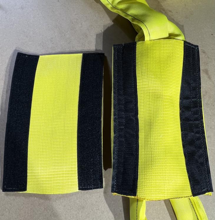 Using the hook and loop method of stacking layers of webbing to make a thicker wear pad. If the top layer is worn through it can be easily removed and replaced with a new top wear pad.